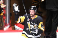Mar 21, 2026; Pittsburgh, Pennsylvania, USA; Pittsburgh Penguins defenseman Erik Karlsson (65) reacts after being named first star of the game against the Winnipeg Jets at PPG Paints Arena. Mandatory Credit: Charles LeClaire-Imagn Images