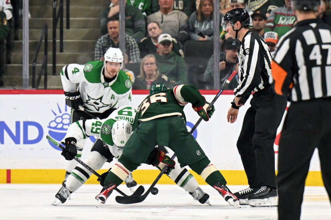 Mar 21, 2026; Saint Paul, Minnesota, USA; Dallas Stars forward Justin Hryckowian (49) and Minnesota Wild forward Mats Zuccarello (36) face off during the third period at Grand Casino Arena. Mandatory Credit: Nick Wosika-Imagn Images