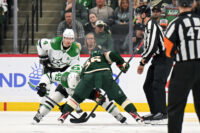 Mar 21, 2026; Saint Paul, Minnesota, USA; Dallas Stars forward Justin Hryckowian (49) and Minnesota Wild forward Mats Zuccarello (36) face off during the third period at Grand Casino Arena. Mandatory Credit: Nick Wosika-Imagn Images