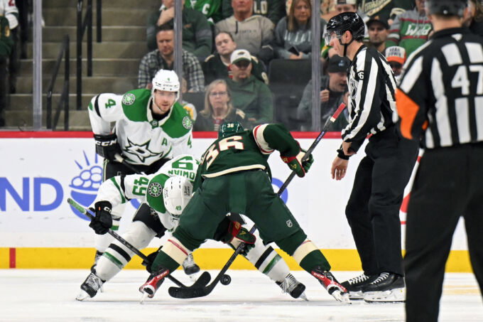 Mar 21, 2026; Saint Paul, Minnesota, USA; Dallas Stars forward Justin Hryckowian (49) and Minnesota Wild forward Mats Zuccarello (36) face off during the third period at Grand Casino Arena. Mandatory Credit: Nick Wosika-Imagn Images