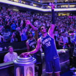 Mar 22, 2026; Sacramento, California, USA; Sacramento Kings forward Precious Achiuwa (9) and center Dylan Cardwell (32) light the beam after the Kings defeat the Brooklyn Nets during the fourth quarter at Golden 1 Center. Mandatory Credit: Justine Willard-Imagn Images