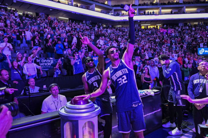 Mar 22, 2026; Sacramento, California, USA; Sacramento Kings forward Precious Achiuwa (9) and center Dylan Cardwell (32) light the beam after the Kings defeat the Brooklyn Nets during the fourth quarter at Golden 1 Center. Mandatory Credit: Justine Willard-Imagn Images