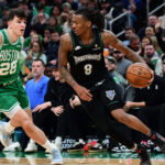 Mar 22, 2026; Boston, Massachusetts, USA; Minnesota Timberwolves guard Bones Hyland (8) controls the ball while Boston Celtics guard Hugo Gonzalez (28) defends during the second half at TD Garden. Mandatory Credit: Bob DeChiara-Imagn Images