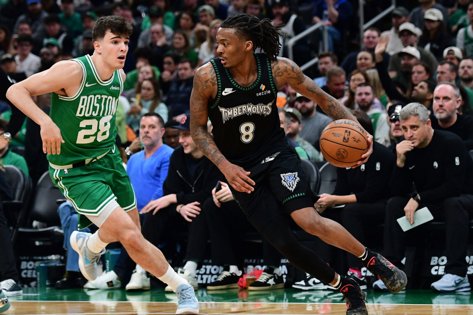 Mar 22, 2026; Boston, Massachusetts, USA; Minnesota Timberwolves guard Bones Hyland (8) controls the ball while Boston Celtics guard Hugo Gonzalez (28) defends during the second half at TD Garden. Mandatory Credit: Bob DeChiara-Imagn Images
