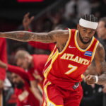 Mar 23, 2026; Atlanta, Georgia, USA; Atlanta Hawks guard Nickeil Alexander-Walker (7) reacts after making a three point basket against the Memphis Grizzlies during the first half at State Farm Arena. Mandatory Credit: Dale Zanine-Imagn Images
