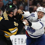 Mar 24, 2026; Boston, Massachusetts, USA; Toronto Maple Leafs center Dakota Joshua (81) fights with Boston Bruins defenseman Nikita Zadorov (91) during the third period at TD Garden. Mandatory Credit: Winslow Townson-Imagn Images