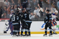 Mar 24, 2026; Salt Lake City, Utah, USA; The Utah Mammoth celebrate a goal by Utah Mammoth left wing Lawson Crouse (67) against the Edmonton Oilers during the second period at Delta Center. Mandatory Credit: Rob Gray-Imagn Images