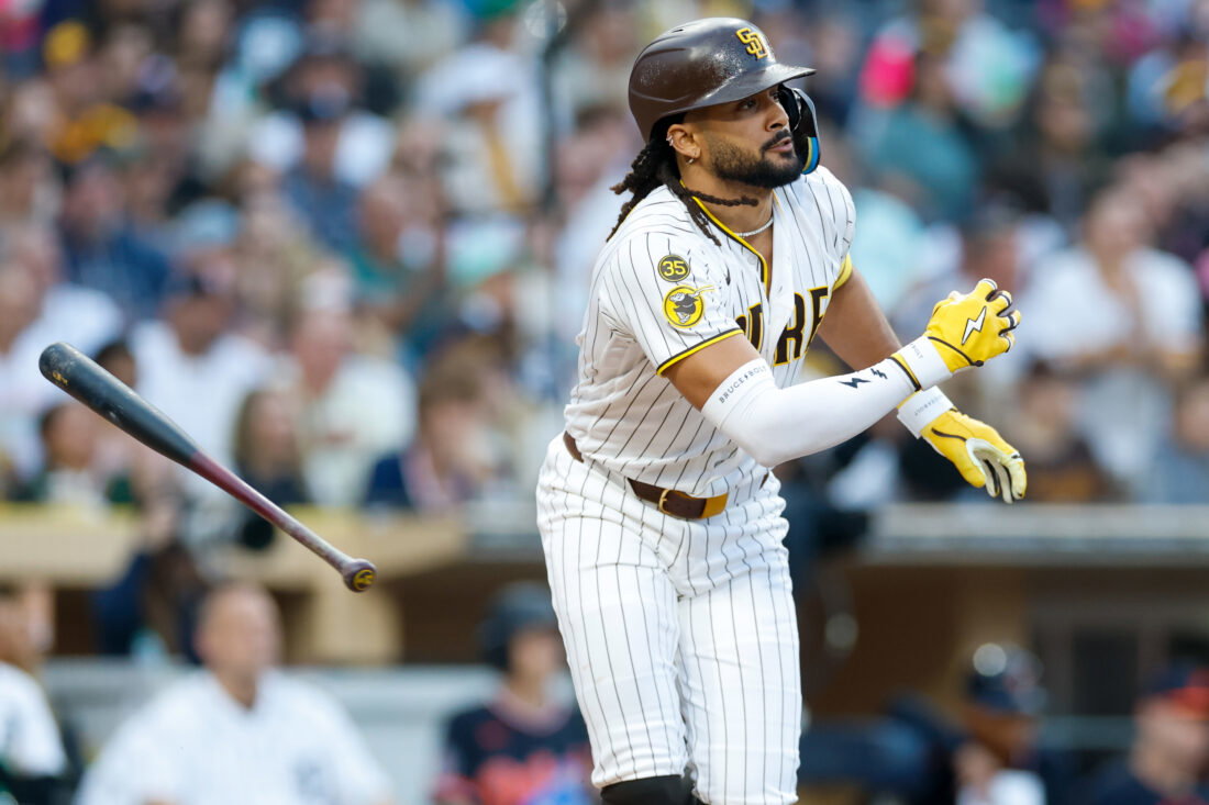 Mar 28, 2026; San Diego, California, USA; San Diego Padres right fielder Fernando Tatis Jr. (23) hits an RBI single during the third inning against the Detroit Tigers at Petco Park. Mandatory Credit: