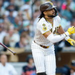 Mar 28, 2026; San Diego, California, USA; San Diego Padres right fielder Fernando Tatis Jr. (23) hits an RBI single during the third inning against the Detroit Tigers at Petco Park. Mandatory Credit: