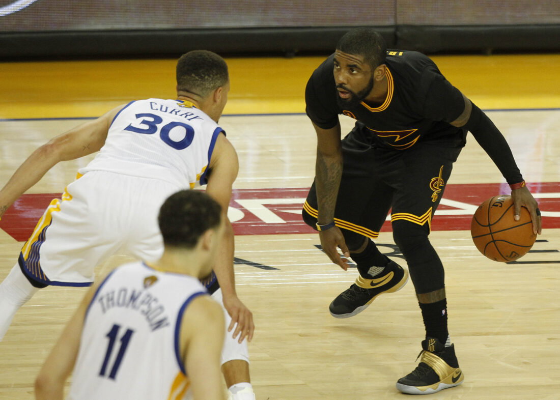 June 19, 2016; Oakland, CA, USA; Cleveland Cavaliers guard Kyrie Irving (2) moves the ball against Golden State Warriors guard Stephen Curry (30) in the second half in game seven of the NBA Finals at Oracle Arena.