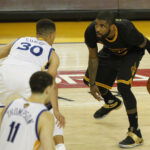 June 19, 2016; Oakland, CA, USA; Cleveland Cavaliers guard Kyrie Irving (2) moves the ball against Golden State Warriors guard Stephen Curry (30) in the second half in game seven of the NBA Finals at Oracle Arena.