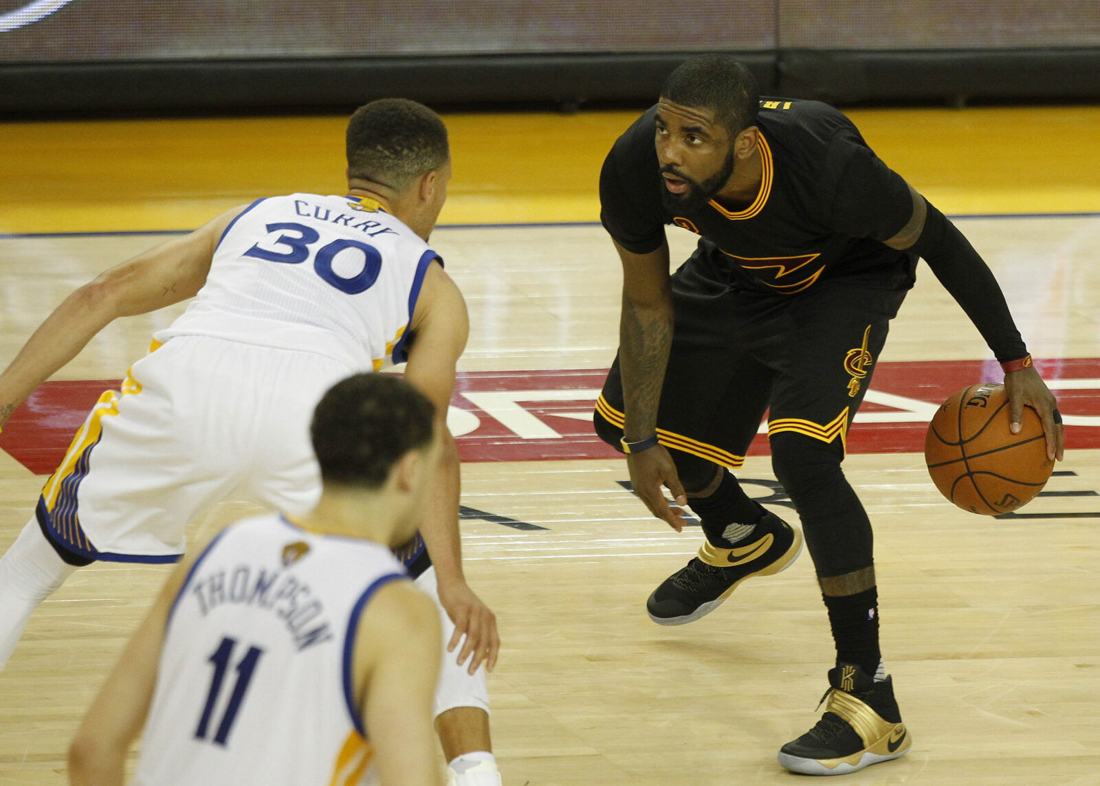 June 19, 2016; Oakland, CA, USA; Cleveland Cavaliers guard Kyrie Irving (2) moves the ball against Golden State Warriors guard Stephen Curry (30) in the second half in game seven of the NBA Finals at Oracle Arena.