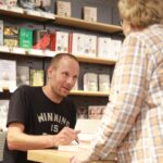 New York Times best-selling author and Mahopac alumnus Jeff Pearlman signs his latest book on the USFL at Barnes & Noble in Scarsdale Sept.12, 2018. Jeff Pearlman
