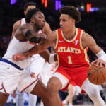 Jan 20, 2025; New York, New York, USA; Atlanta Hawks forward Jalen Johnson (1) is guarded by New York Knicks forward OG Anunoby (8) during the second half at Madison Square Garden. Mandatory Credit: Vincent Carchietta-Imagn Images