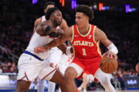 Jan 20, 2025; New York, New York, USA; Atlanta Hawks forward Jalen Johnson (1) is guarded by New York Knicks forward OG Anunoby (8) during the second half at Madison Square Garden. Mandatory Credit: Vincent Carchietta-Imagn Images