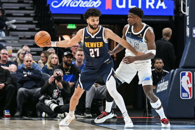 Jan 25, 2025; Minneapolis, Minnesota, USA; Denver Nuggets guard Jamal Murray (27) is defended by Minnesota Timberwolves guard Anthony Edwards (5) during the third quarter at Target Center. Mandatory Credit: Jeffrey Becker-Imagn Images