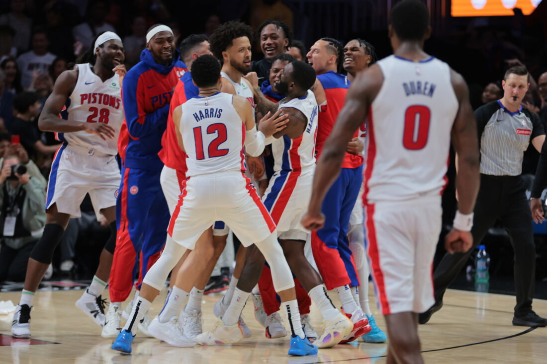 Mar 19, 2025; Miami, Florida, USA; Detroit Pistons guard Cade Cunningham (2) celebrates with forward Tim Hardaway Jr. (8), forward Tobias Harris (12) and other teammates after scoring the game-winning basket against the Miami Heat during the fourth quarter at Kaseya Center. Mandatory Credit: Sam Navarro-Imagn Images