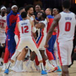 Mar 19, 2025; Miami, Florida, USA; Detroit Pistons guard Cade Cunningham (2) celebrates with forward Tim Hardaway Jr. (8), forward Tobias Harris (12) and other teammates after scoring the game-winning basket against the Miami Heat during the fourth quarter at Kaseya Center. Mandatory Credit: Sam Navarro-Imagn Images