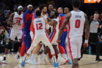Mar 19, 2025; Miami, Florida, USA; Detroit Pistons guard Cade Cunningham (2) celebrates with forward Tim Hardaway Jr. (8), forward Tobias Harris (12) and other teammates after scoring the game-winning basket against the Miami Heat during the fourth quarter at Kaseya Center. Mandatory Credit: Sam Navarro-Imagn Images