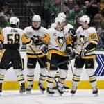 Apr 5, 2025; Dallas, Texas, USA; Pittsburgh Penguins defenseman Kris Letang (58) and right wing Rutger McGroarty (2) and center Evgeni Malkin (71) and defenseman Erik Karlsson (65) celebrate after Penguins center Sidney Crosby (87)