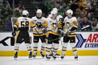 Apr 5, 2025; Dallas, Texas, USA; Pittsburgh Penguins defenseman Kris Letang (58) and right wing Rutger McGroarty (2) and center Evgeni Malkin (71) and defenseman Erik Karlsson (65) celebrate after Penguins center Sidney Crosby (87)