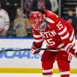 Apr 12, 2025; St. Louis, Missouri, UNITED STATES; Boston University Terriers forward Matt Copponi (15) reacts after Boston University lost to Western Michigan Broncos in the Frozen Four college ice hockey national championship at Enterprise Center.