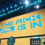 Apr 24, 2025; Green Bay, WI, USA; The Los Angeles Chargers logo is projected on the video board during the NFL Draft at Lambeau Field. Mandatory Credit: Kirby Lee-Imagn Images