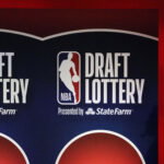 May 12, 2025; Chicago, Illinois, US; A person watches the 2025 NBA Draft Lottery at McCormick Place. Mandatory Credit: David Banks-Imagn Images