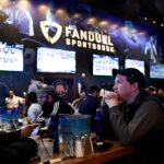 Seamus Magee, right, and Anthony Mea, both of Hoboken, watch the first games of the NCAA basketball tournament at the Meadowlands Racetrack, where sports fans can legally bet on March Madness games for the first time in New Jersey on Thursday, March 21, 2019, in East Rutherford.