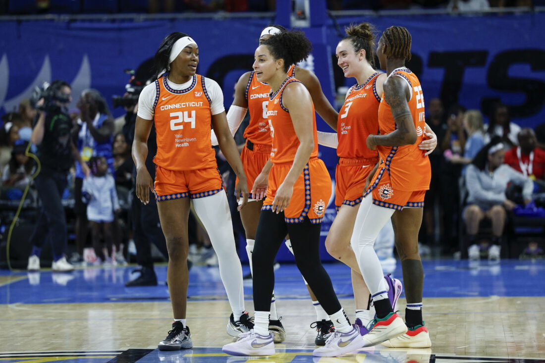 Aug 23, 2025; Chicago, Illinois, USA; Connecticut Sun players celebrate teams win against the Chicago Sky in a WNBA game at Wintrust Arena.