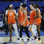 Aug 23, 2025; Chicago, Illinois, USA; Connecticut Sun players celebrate teams win against the Chicago Sky in a WNBA game at Wintrust Arena.