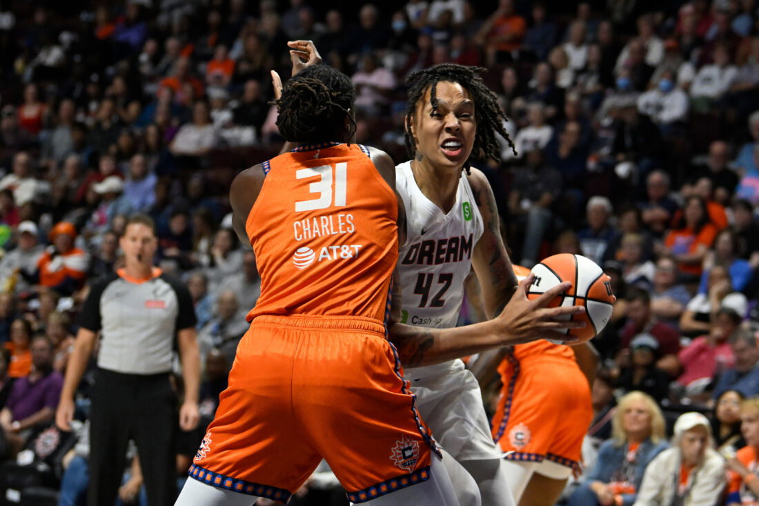 Sep 10, 2025; Uncasville, Connecticut, USA; Atlanta Dream center Brittney Griner (42) drives to the basket against Connecticut Sun center Tina Charles (31) during the first half at Mohegan Sun Arena. Mandatory Credit: Eric Canha-Imagn Images