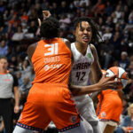 Sep 10, 2025; Uncasville, Connecticut, USA; Atlanta Dream center Brittney Griner (42) drives to the basket against Connecticut Sun center Tina Charles (31) during the first half at Mohegan Sun Arena. Mandatory Credit: Eric Canha-Imagn Images