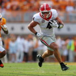 Sep 13, 2025; Knoxville, Tennessee, USA; Georgia Bulldogs tight end Oscar Delp (4) runs the ball as Georgia Bulldogs defensive back Daylen Everette (6) defends during the second half at Neyland Stadium. Mandatory Credit: Alan Poizner-Imagn Images
