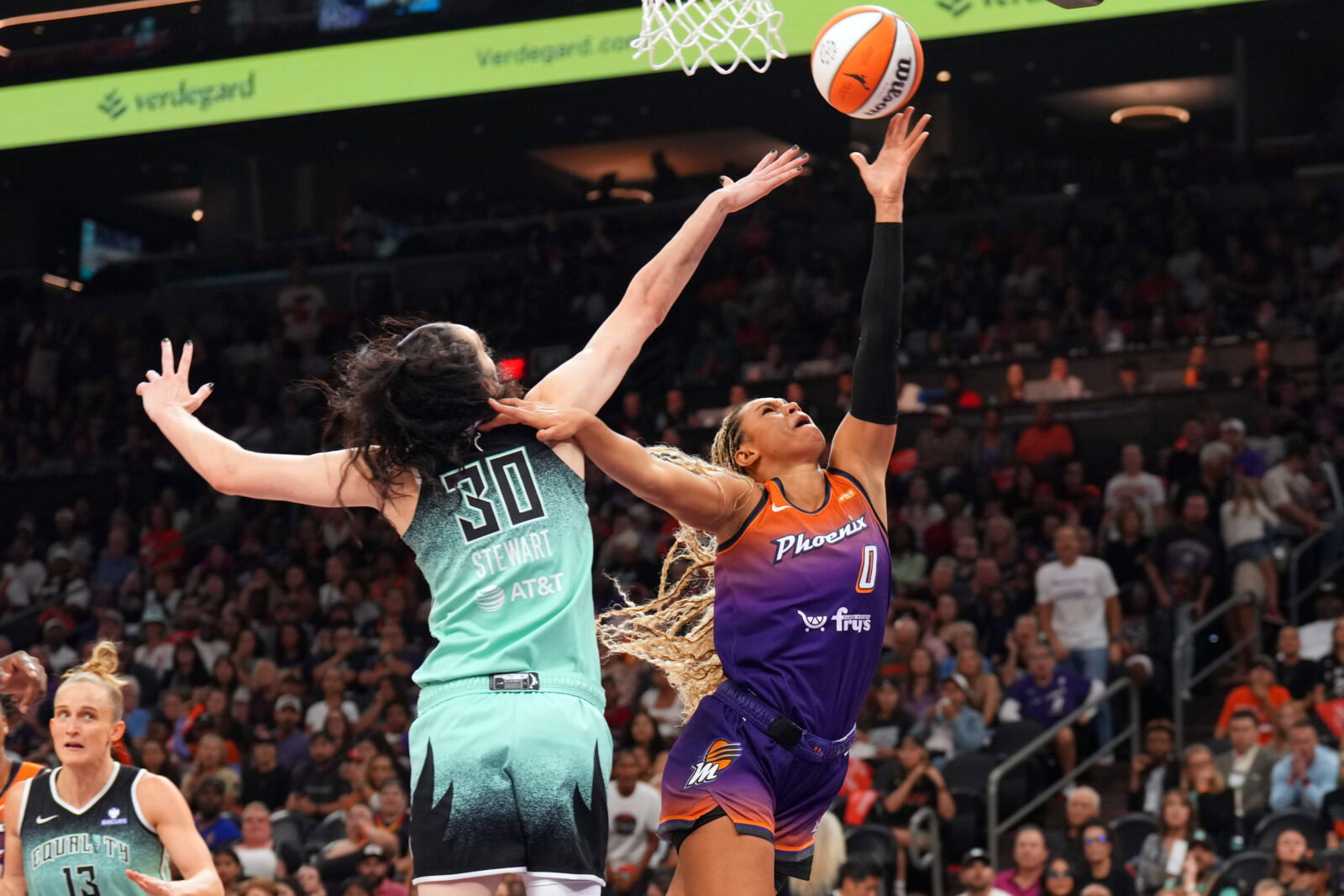 Sep 19, 2025; Phoenix, Arizona, USA; Phoenix Mercury forward Satou Sabally (0) shoots over New York Liberty forward Breanna Stewart (30) during the second half of game three of round one for the 2025 WNBA Playoffs at PHX Arena. Mandatory Credit: Joe Camporeale-Imagn Images