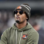 Nov 23, 2025; Paradise, Nevada, USA; Cleveland Browns quarterback Deshaun Watson watches on the sidelines against the Las Vegas Raiders in the second half at Allegiant Stadium. Mandatory Credit: Kirby Lee-Imagn Images