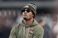 Nov 23, 2025; Paradise, Nevada, USA; Cleveland Browns quarterback Deshaun Watson watches on the sidelines against the Las Vegas Raiders in the second half at Allegiant Stadium. Mandatory Credit: Kirby Lee-Imagn Images