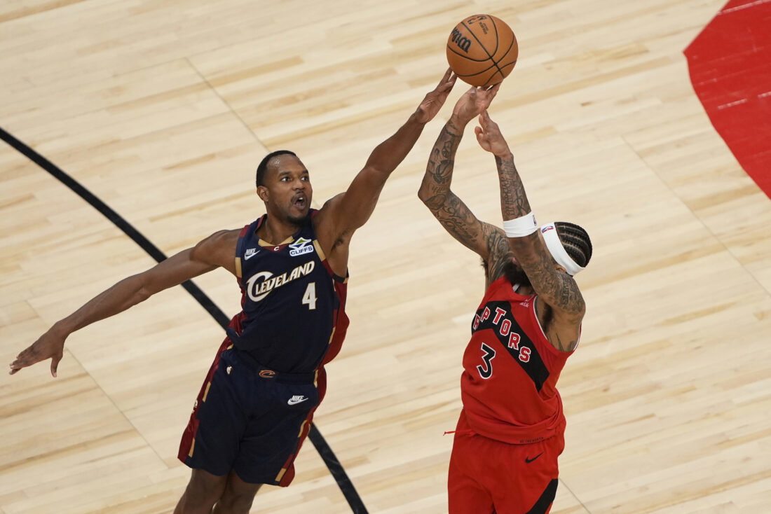 Nov 24, 2025; Toronto, Ontario, CAN; Cleveland Cavaliers forward Evan Mobley (4) tries to block a shot by Toronto Raptors forward Brandon Ingram (3) during the second half at Scotiabank Arena. Mandatory Credit: John E. Sokolowski-Imagn Images