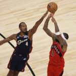 Nov 24, 2025; Toronto, Ontario, CAN; Cleveland Cavaliers forward Evan Mobley (4) tries to block a shot by Toronto Raptors forward Brandon Ingram (3) during the second half at Scotiabank Arena. Mandatory Credit: John E. Sokolowski-Imagn Images