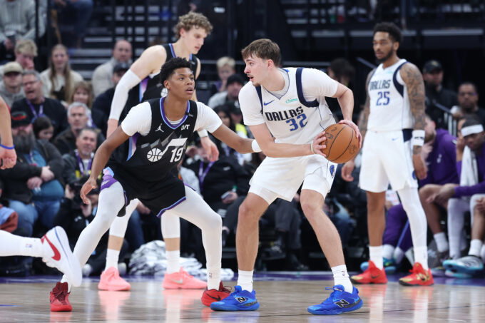 Dec 15, 2025; Salt Lake City, Utah, USA; Dallas Mavericks forward Cooper Flagg (32) holds the ball as Utah Jazz guard Ace Bailey (19) defends at Delta Center. Mandatory Credit: Rob Gray-Imagn Images