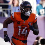 Dec 21, 2025; Denver, Colorado, USA; Denver Broncos wide receiver Courtland Sutton (14) reacts after scoring a touchdown against the Jacksonville Jaguars during the first half at Empower Field at Mile High. Mandatory Credit: Ron Chenoy-Imagn Images