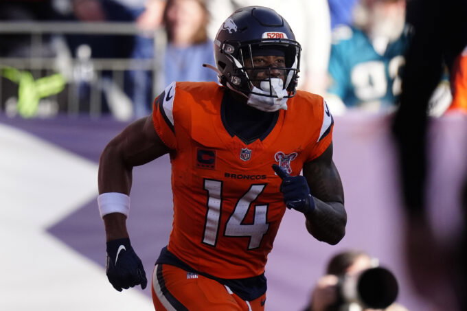 Dec 21, 2025; Denver, Colorado, USA; Denver Broncos wide receiver Courtland Sutton (14) reacts after scoring a touchdown against the Jacksonville Jaguars during the first half at Empower Field at Mile High. Mandatory Credit: Ron Chenoy-Imagn Images