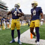 Notre Dame running back Jeremiyah Love (4) makes a heart sign after scoring a touchdown in the first half of a NCAA football game against Syracuse at Notre Dame Stadium on Saturday, Nov. 22, 2025, in South Bend.
