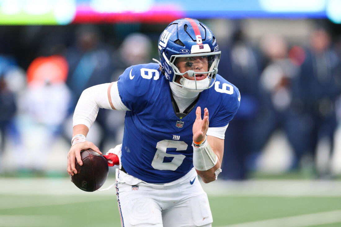 Jan 4, 2026; East Rutherford, New Jersey, USA; New York Giants quarterback Jaxson Dart (6) scrambles during the fourth quarter against the Dallas Cowboys at MetLife Stadium.