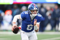 Jan 4, 2026; East Rutherford, New Jersey, USA; New York Giants quarterback Jaxson Dart (6) scrambles during the fourth quarter against the Dallas Cowboys at MetLife Stadium.