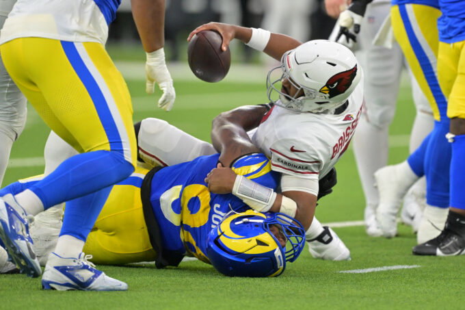 Jan 4, 2026; Inglewood, California, USA; Los Angeles Rams defensive end Desjuan Johnson (94) sacks Arizona Cardinals quarterback Jacoby Brissett (7) during the second half at SoFi Stadium. Mandatory Credit: Jayne Kamin-Oncea-Imagn Images