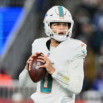 Jan 4, 2026; Foxborough, Massachusetts, USA; Miami Dolphins quarterback Zach Wilson (0) looks to throw a pass against the New England Patriots during the fourth quarter at Gillette Stadium. Mandatory Credit: Brian Fluharty-Imagn Images