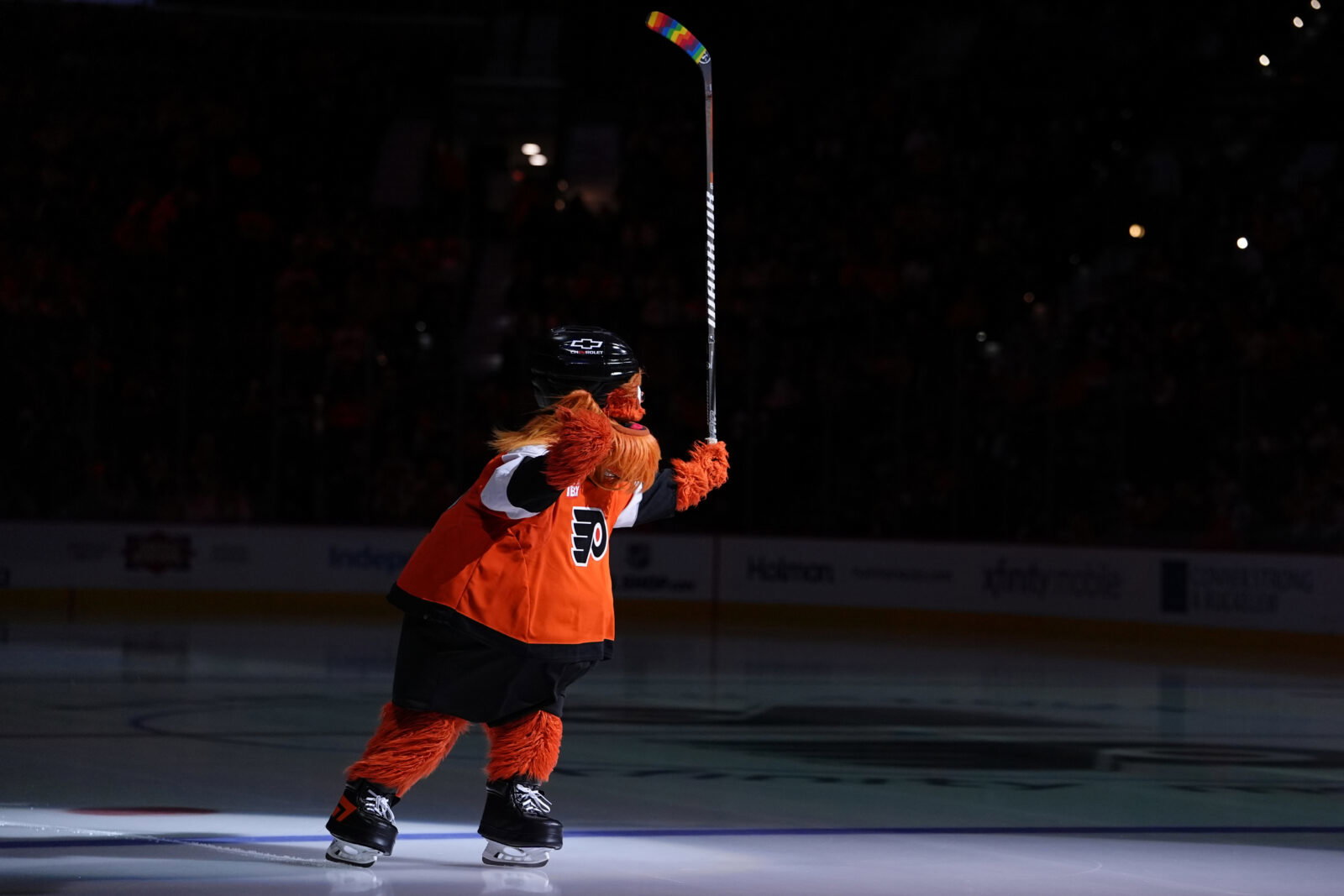 Jan 12, 2026; Philadelphia, Pennsylvania, USA; Philadelphia Flyers mascot Gritty entertains fans with rainbow stick tape for Pride Night before the game against the Tampa Bay Lightning at Xfinity Mobile Arena. Mandatory Credit: Kyle Ross-Imagn Images