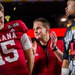 Indiana Head Coach Curt Cignetti claps on the podium after the College Football Playoff National Championship college football game at Hard Rock Stadium in Miami Gardens on Monday, Jan. 19, 2026.