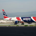 Feb 1, 2026; Santa Clara, CA, USA; The New England Patriots private Boeing 767-300 team airplane (registration N36NE) arrives to Super Bowl LX at San Jose Mineta International Airport. Mandatory Credit: Kirby Lee-Imagn Images